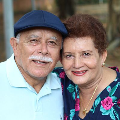 man and woman smiling at camera