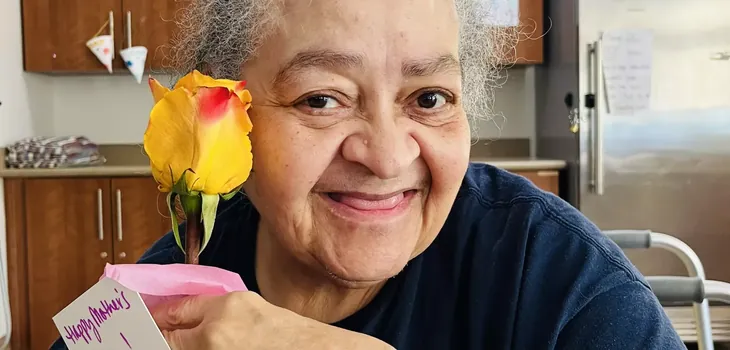 DCHC foundation 5_730x350 Woman holding yellow flower next to her face