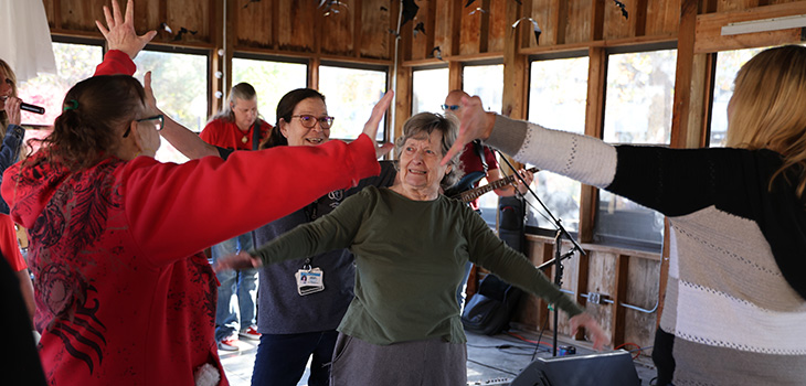 A group of residents dancing at an event at Douglas County.