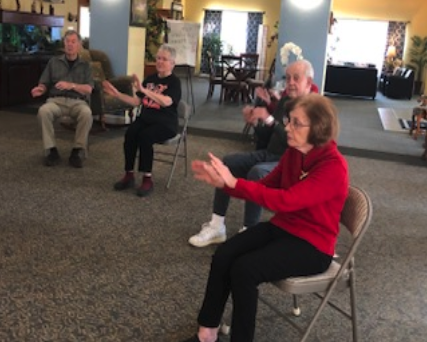 Residents exercising in chairs