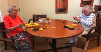 Residents doing an activity at a table