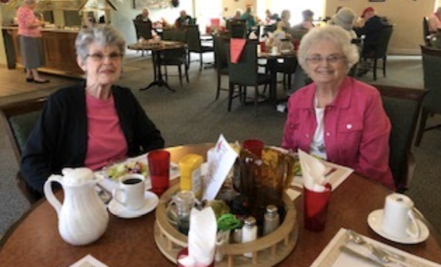 Two ladies eating together.