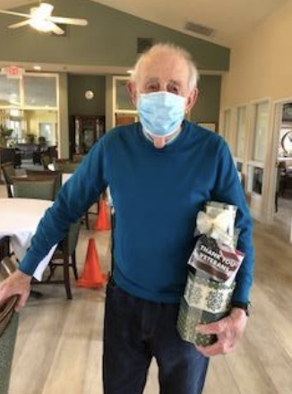 A Veteran Resident Accepting A Gift At Sonoma Hills