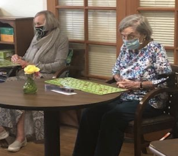 Residents With Masks On Playing Bingo