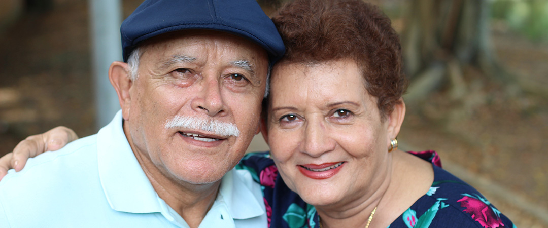 Two seniors smiling outside together