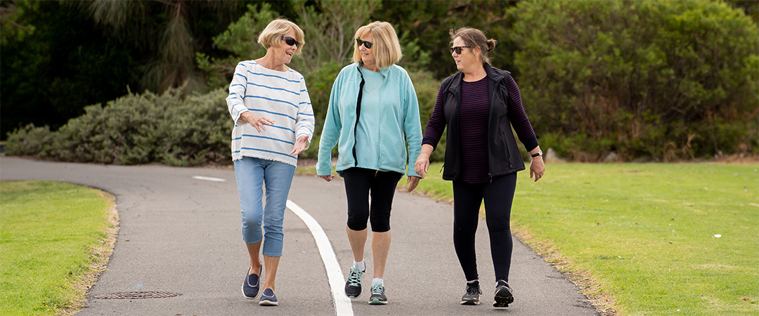 three women doing walking activities