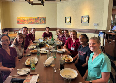 A group of Lowry Hills employees eating at a restaurant together