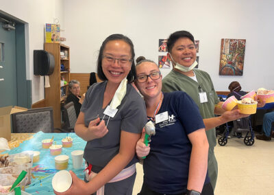 Three nurses at an activity at Lowry Hills