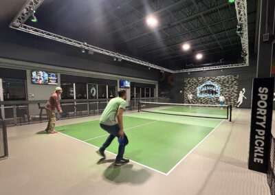 Four employees playing pickleball together