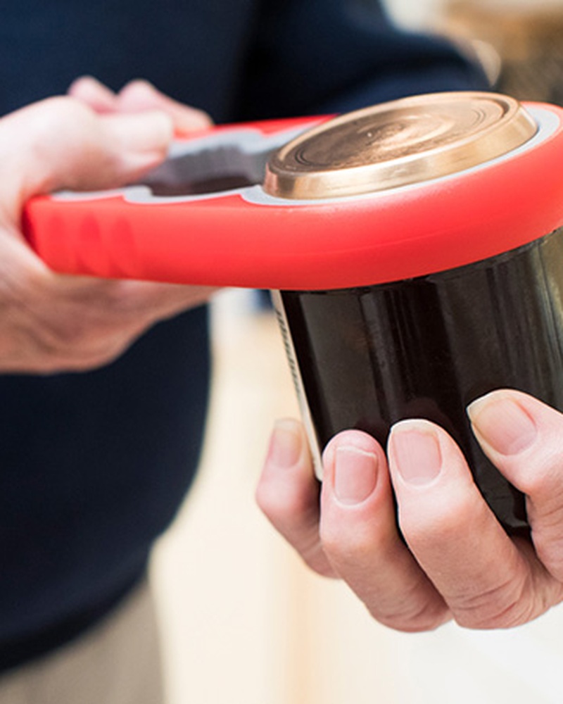 Senior hands squeezing cup for occupational therapy.