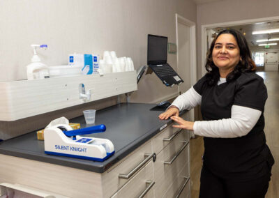 A nurse standing at the nurse's station at Oak Ridge