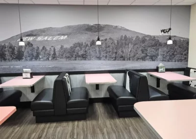 Booths with cow print and pink tables
