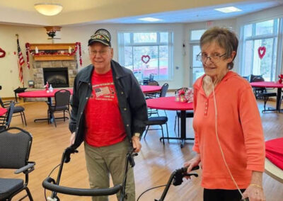 Two residents standing together at Elm Crest
