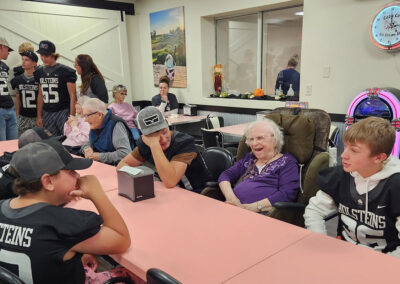 Residents laughing and talking together at Elm Crest
