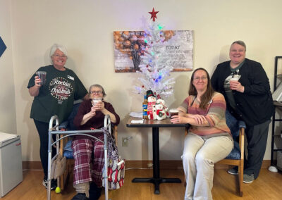 Residents and employees at a Christmas activity at Elm Crest