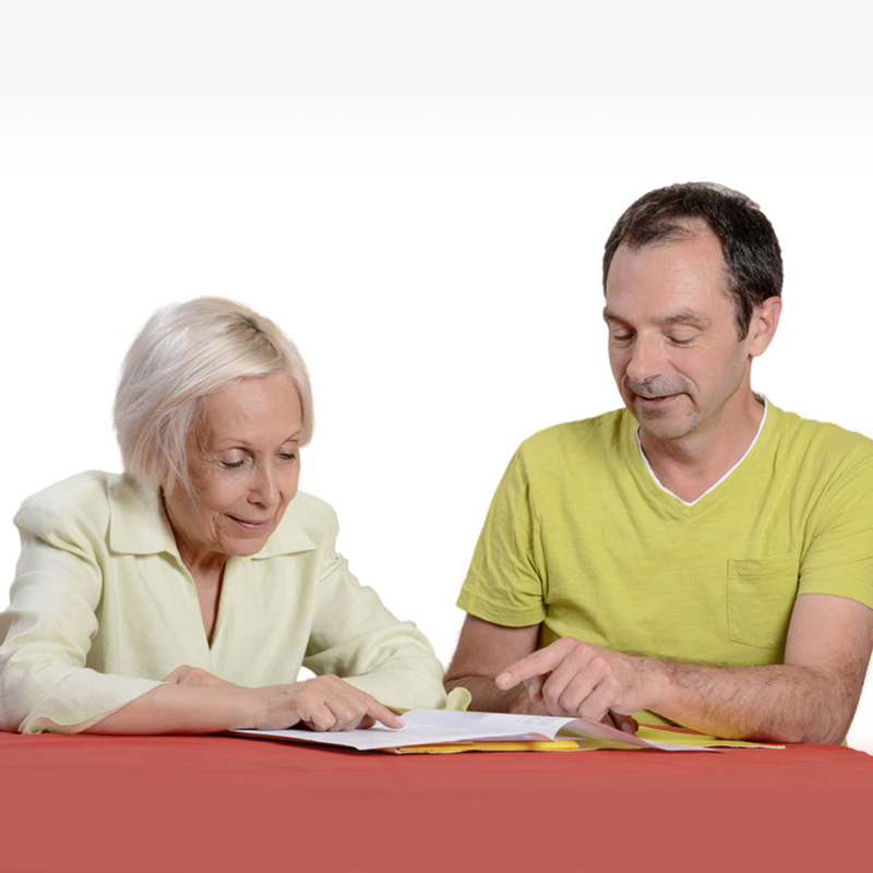 Male speech therapist working with a resident in speech therapy
