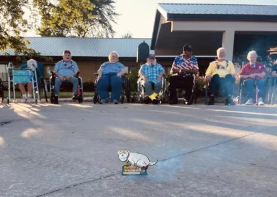 Group of people outside in chairs
