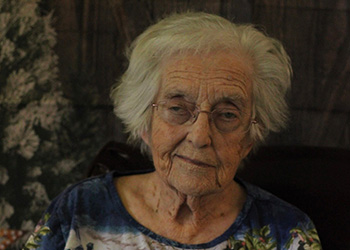 two women petting a pony