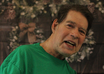 two women petting a pony