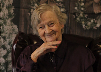 two women petting a pony