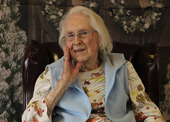 two women petting a pony