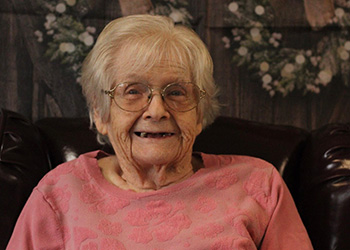 woman petting a horse