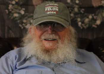 two women petting a pony