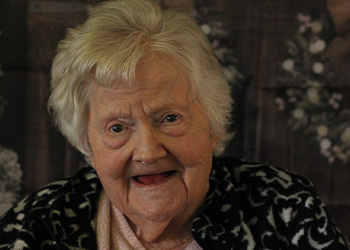 woman petting a horse