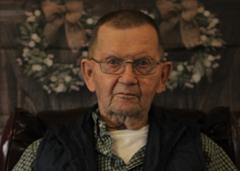 resident petting a dog