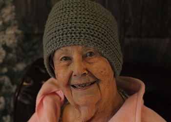 resident petting a dog