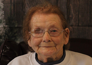 patient smiling with reindeer antlers on