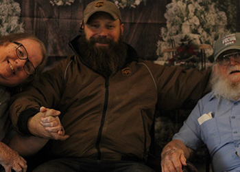 patient smiling with reindeer antlers on