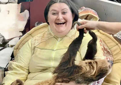 Mikie and a sloth, pet therapy interactions