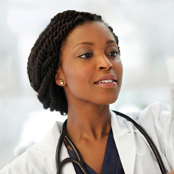 A nurse changing an IV bag.