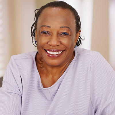An elderly woman smiling