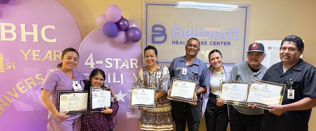 staff with awards at the anniversary celebration