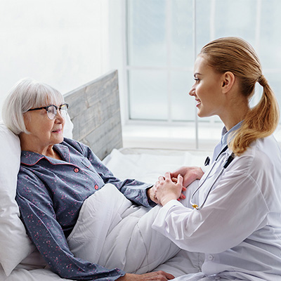 Nurse Helping Elderly Women