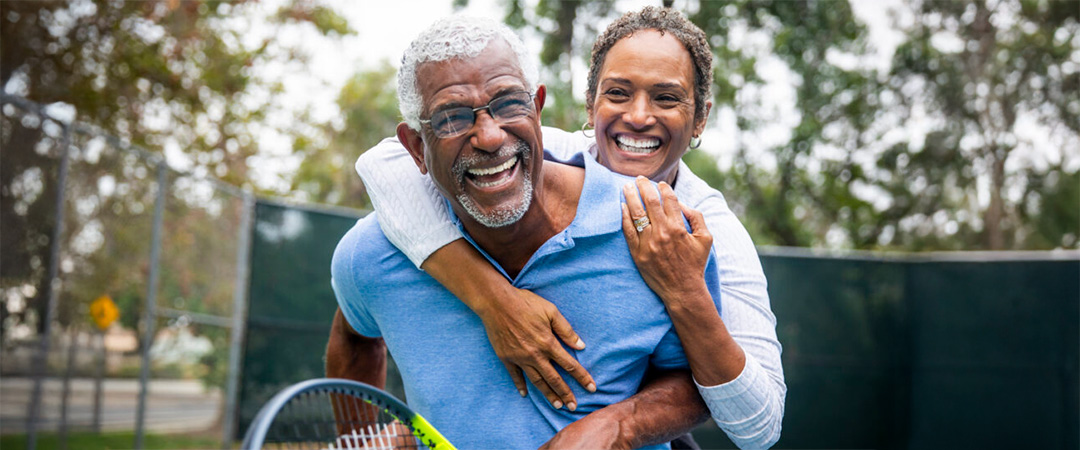 a senior couple on a tennis court