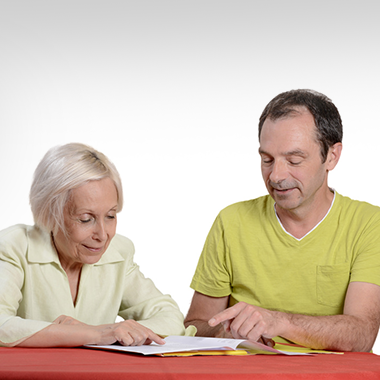 therapist pointing out words for resident to read during therapy