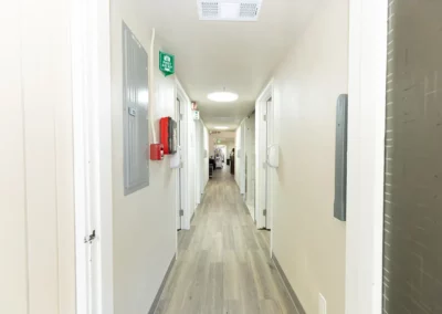 A bright, clean hallway leading to patient rooms