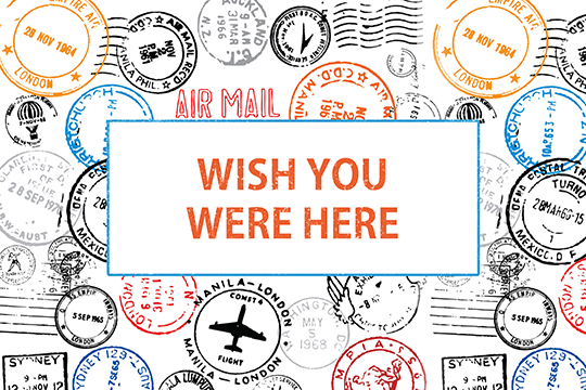 Wish You Were Here card with passport stamps in background