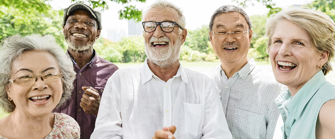 A group of elderly people laughing together