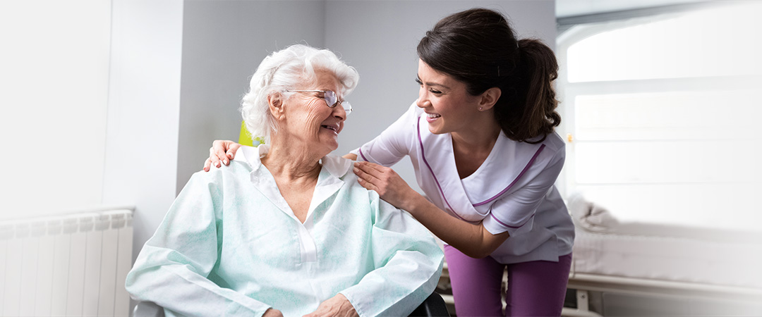 An elderly woman with a nurse