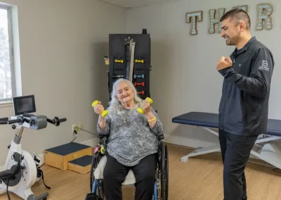 A rehab therapist with a resident in the rehab gym at Los Banos