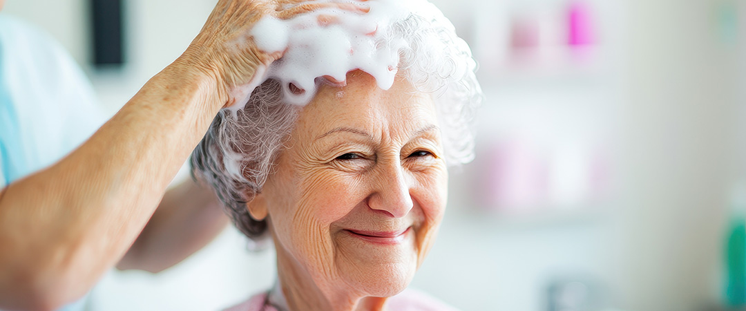 Woman having her hair washed and smiling