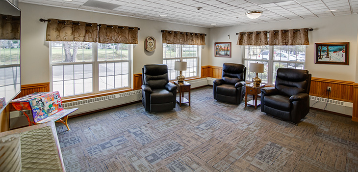 Spacious lounge area with a few comfy recliners.