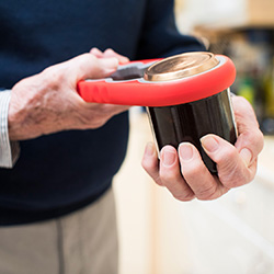 A man squeezing on object with his hands.