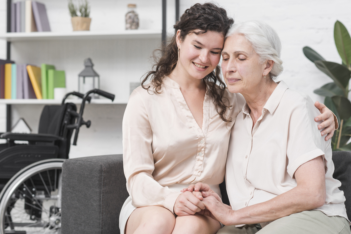 nurse holding woman smiling