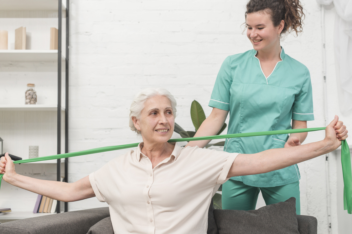 woman doing physical therapy with a nurse