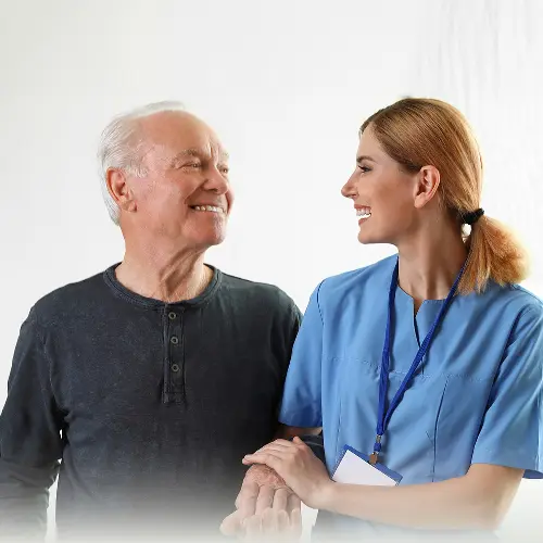 A nurse helps a patient walk